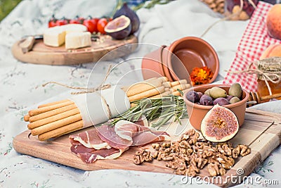 Close up delicious picnic food on blanket concept photo Stock Photo