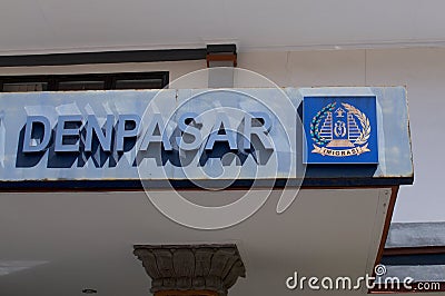 Close up of the Denpasar text and Imigrasi Immigration Logo in Bali Editorial Stock Photo