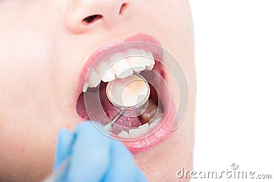 Close-up of dentist hand with glove handling mirror for seeing Stock Photo