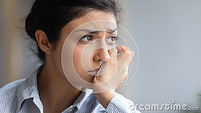 Close up depressed unhappy Indian woman thinking about problems Stock Photo