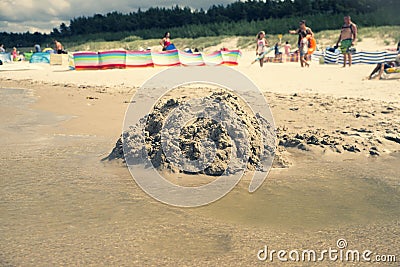 Close up on destroyed sand castle on the beach Stock Photo