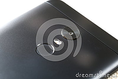 Close-up detail of cellphone with security thumb fingerprint scanning device and camera. Modern technology security and smartphone Stock Photo
