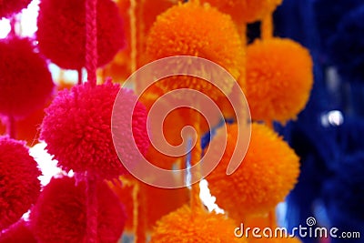 Close up Detail of Cheerful Yarn Pompom Hanging Decoration Stock Photo