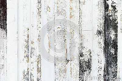 Close-up detail of grunge paint on rusty white metal wall. Stock Photo