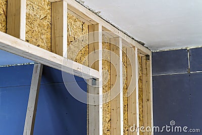 Close up detail of house construction wooden wall elements. Interior frame renovation work Stock Photo