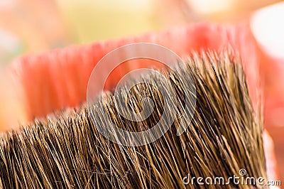 Close up of detail paint brushes over a color palette in a studio, in a blurred background Stock Photo