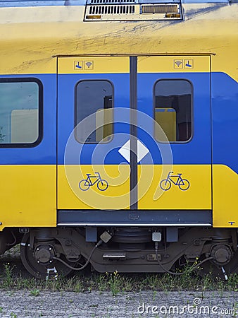 Close up detail of the Sliding Doors and associated Safety Markings on old urban Dutch Railway Passenger Compartments. Editorial Stock Photo