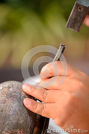 Thai artisan hammers nielloware engraving, Bangkok, Thailand Stock Photo