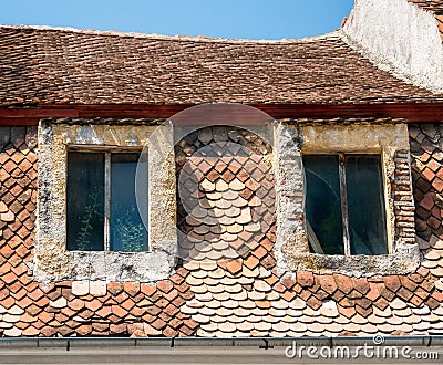 Close up detail with a worn out old medieval building in the center of Brasov, Romania Stock Photo