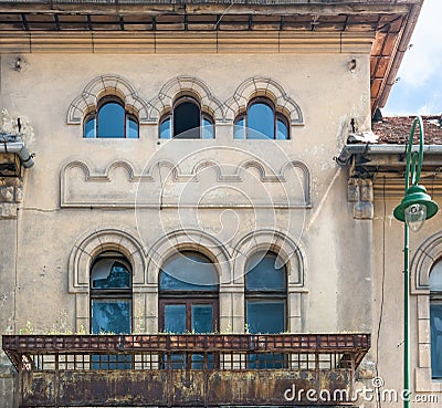 Close up detail with a worn out old medieval building in the center of Brasov, Romania Stock Photo