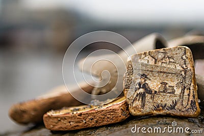 Mudlarking on the River Thames: Close up of a detailed piece of old broken pottery found along a river Stock Photo