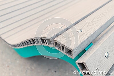Close-up view of the Assembly of accessories for benches and sun beds on the city embankment Stock Photo