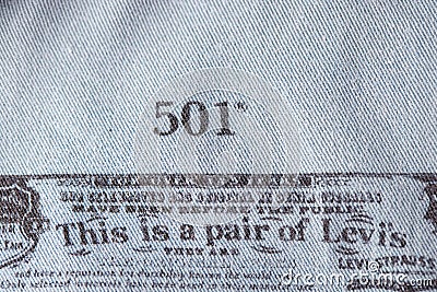 Close up of the details of new LEVI'S 501 Jeans on the inside. label and stamp LEVI'S. Classic jeans model Levi Editorial Stock Photo