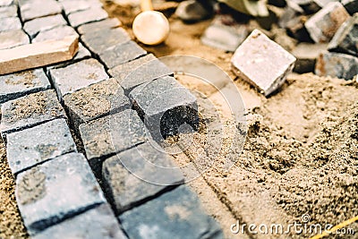 details of roadworks. Stonework on footpath at construction site Stock Photo