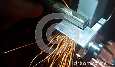 details of sparks, industrial worker using angle grinder and cutting steel Stock Photo