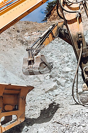 Close up details of track type excavator industrial scoop Stock Photo