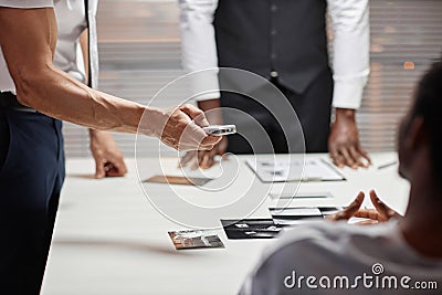 Close up of detective holding voice recorder during interrogation of suspect Stock Photo