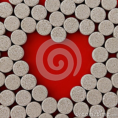 Close-up of DGL licorice root extract chewable tablets. dietary concept: pills around a central empty space in the form of a Stock Photo
