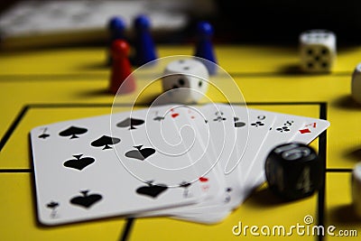 Close up of dices and cards on yellow game board Stock Photo