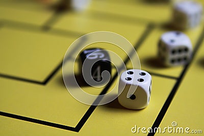 Close up of dices on yellow game board Stock Photo