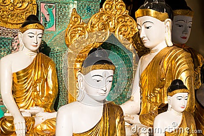 Close up of different sized golden Buddhas Stock Photo