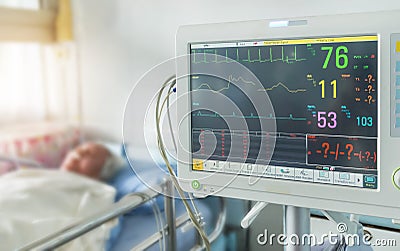 Close up digital device for measuring blood pressure monitor with elderly patient sleep on the bed in hospital Stock Photo