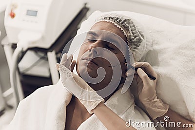Close up. Doctor Doing Cosmetic Procedure for Man. Stock Photo
