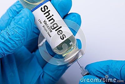 Doctor Filling Shingles Vaccine Syringe Stock Photo
