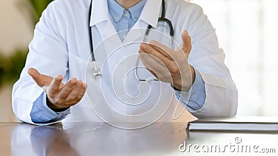 Close up doctor therapist consulting patient, sitting at table Stock Photo