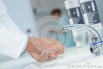 Close up doctor washing hands Stock Photo