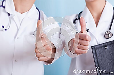 Close-up of a doctors showing thumbs up sign Stock Photo