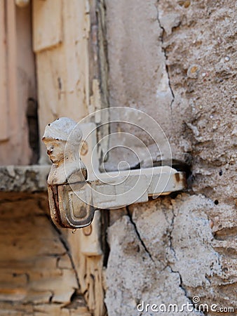 Close-up of a door knocker on the side of an aged structure Stock Photo