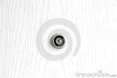 Close up door lens peephole on white wooden texture Stock Photo