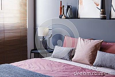 Close-up of a double bed decorated with pillows in a hotel room Stock Photo