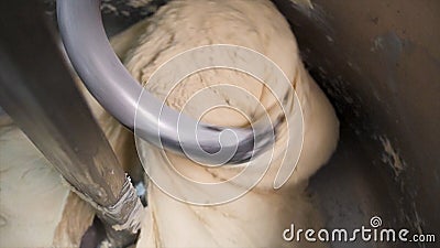 Close up for dough kneading on a bread bakery production factory. Stock footage. Bread Mixer In Bakery, mixing dough for Stock Photo