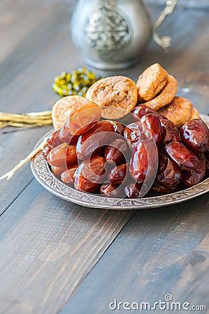 Close up of dried date fruits or kurma and figs served on a old Stock Photo