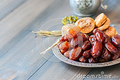 Close up of dried date fruits or kurma and figs served on a old Stock Photo