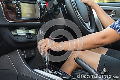 Close up driver left hand shifting the gear stick Stock Photo