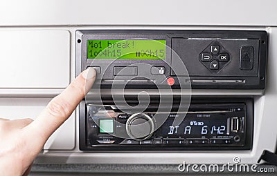 Close up of a driver and tachograph with 15 minutes of driving left warning on display Stock Photo