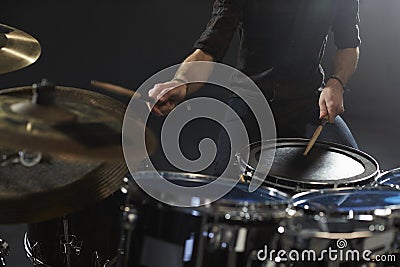 Close Up Of Drummer Playing Drum Kit In Studio Stock Photo