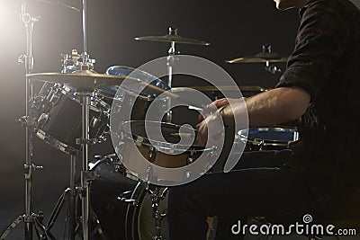 Close Up Of Drummer Playing Drum Kit In Studio Stock Photo