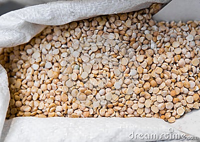 Close up on a dry raw chickpeas in a box. Macro. Healthy dietary food rich in microelements cellulose. Food for Stock Photo