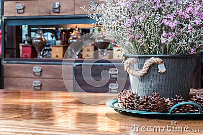 Close up dry Statice flower in pot on wooden table Stock Photo
