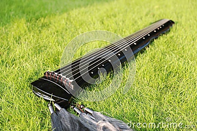 Close-up eastern Asican Chinese traditional ancient historic Guzheng zither plucking instruments of China Stock Photo