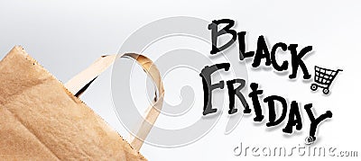 Close-up of eco paper bag and black friday words isolated on white background. Stock Photo