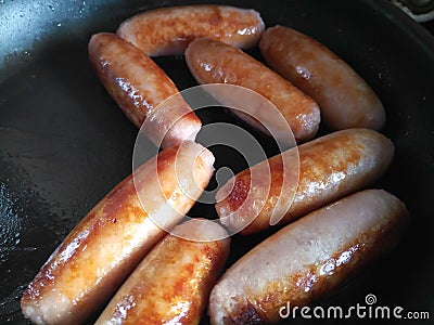 Close up of eight pork sausages Stock Photo