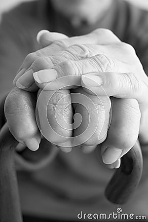 Close-Up Of Elderly Persons Hand Resting On Walkin Stock Photo