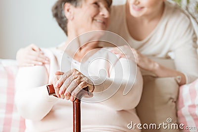 Close-up of elderly woman holding walking stick in the nursing h Stock Photo