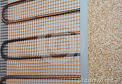 A close-up of an electric radiant wall heater. Electric radiant heating system maintenance Stock Photo