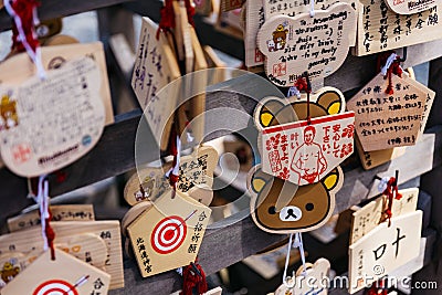 Close up Ema are small wooden plaques, common to Japan, in which Shinto and Buddhist worshippers write prayers or wishes. Stock Photo